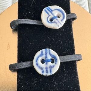 Two handmadede hairties with ceramic handmade buttons